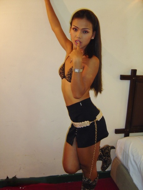 Flat-chested slender ladyboy Emma showing off her rideable shemale cock