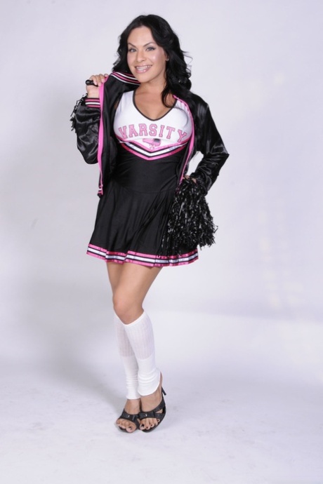 Busty shemale cheerleader TS Foxxy flashes sex ass in naked uniform upskirt