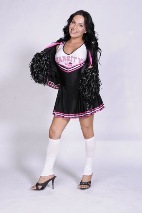 Busty shemale cheerleader TS Foxxy flashes sex ass in naked uniform upskirt