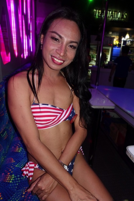 Sexy shemale performers pose in bars for hot bikini candid photos