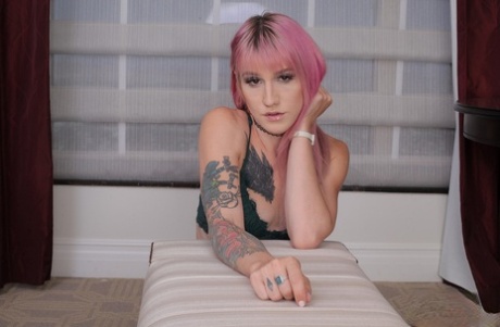 Skinny pink-haired shemale babe Lena Kelly gives a steamy handjob in POV