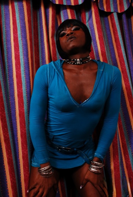 Black shemale Chanel loses her dress and undies before masturbating