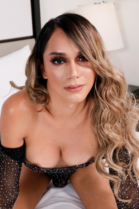 Exotic shemale Angelllurbby strips off her sheer bodysuit & poses naked