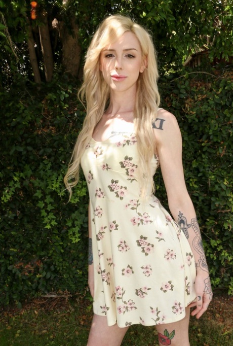Cute skinny shemale Annabelle Lane lifts up her dress and shows her dick
