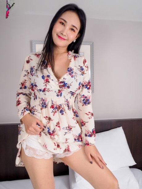 Curvy Asian babe Vida undresses & toys her trimmed pussy with a dildo