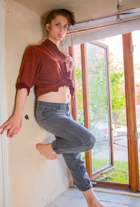 Skinny shemale Ava Bloom shows her big dick and poses naked in a solo