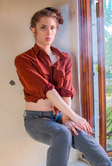 Skinny shemale Ava Bloom shows her big dick and poses naked in a solo