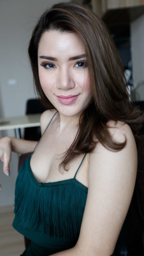 Sexy ladyboy Peach posing in her hot outfit and high heels in a solo