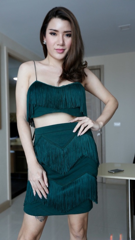 Sexy ladyboy Peach posing in her hot outfit and high heels in a solo
