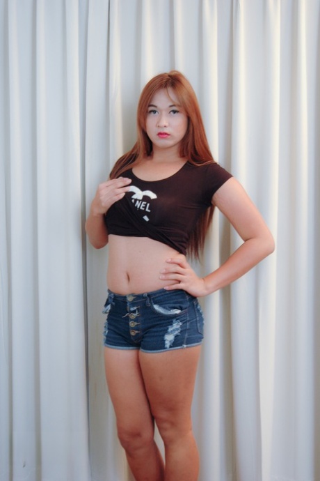 Sexy tranny with tiny tits Pur undresses and takes a boner from behind